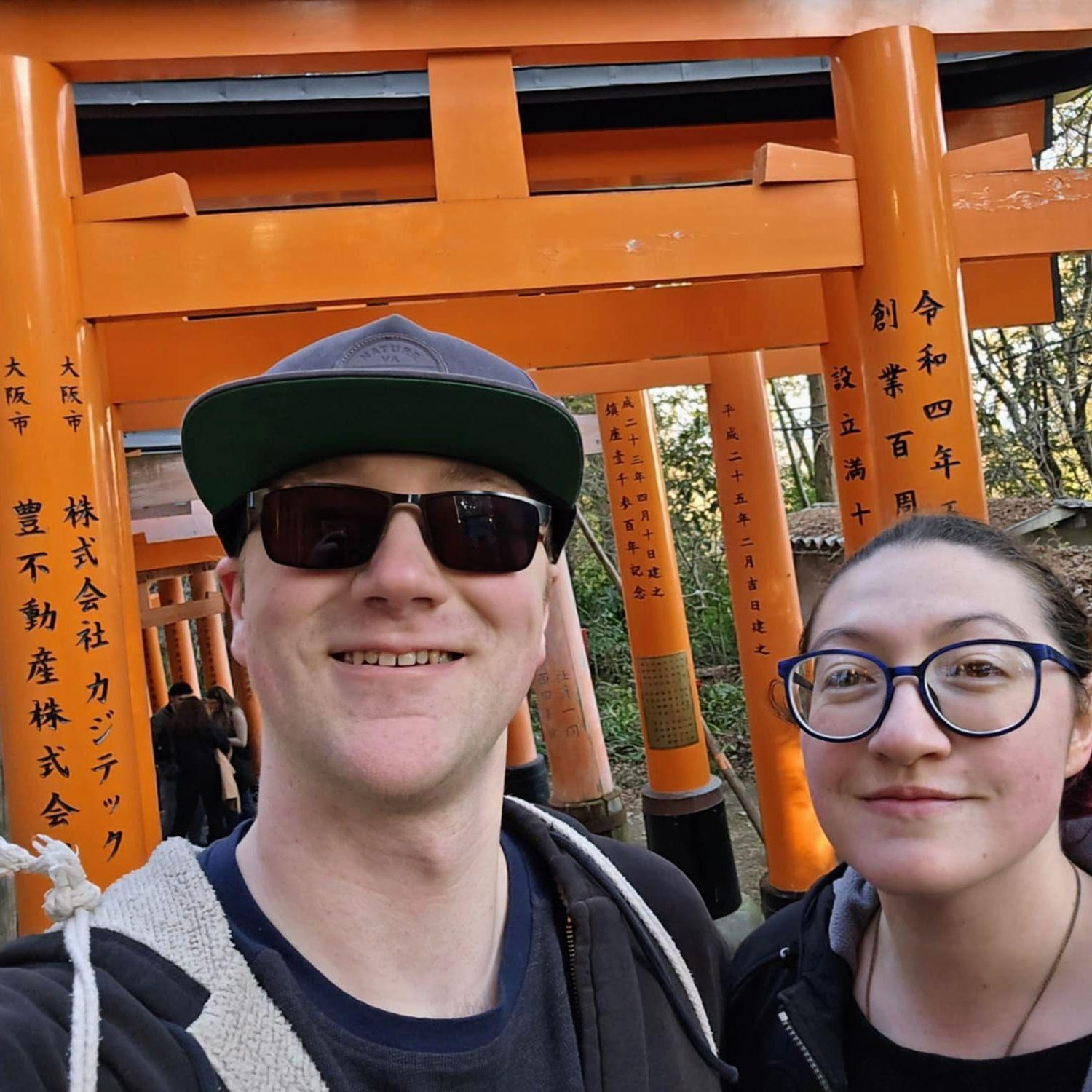 In front of the Thousand Torii Gates in Kyoto. We had already walked all around Kyoto before deciding to go to see them. Then we had to hike up a mountain for an hour to see all the Torii gates.