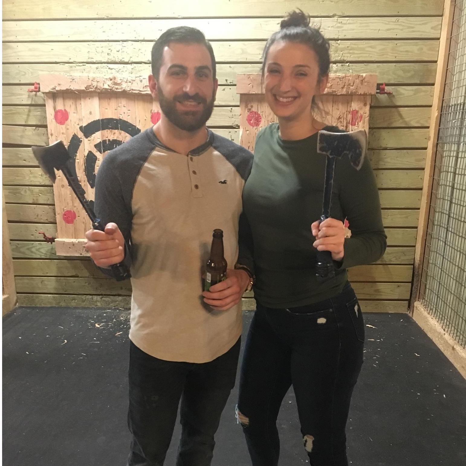 Having fun at axe throwing.
