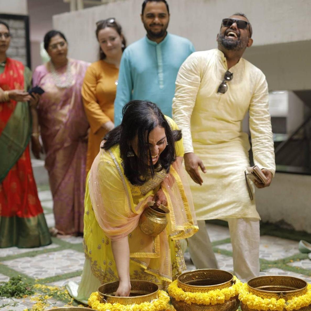 Partaking in Indian traditions at our friends' weddings.