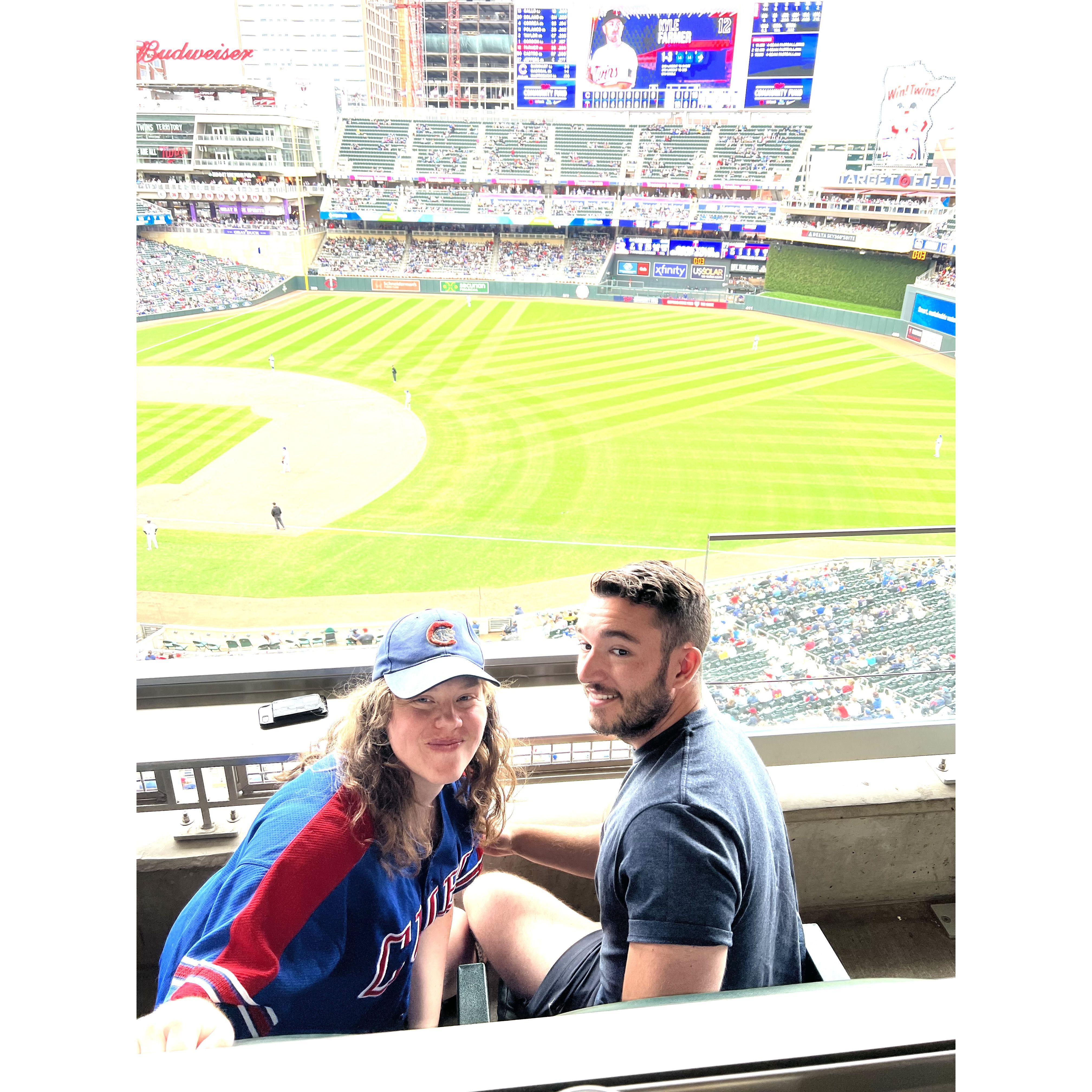 Sam's and Sara's bucket list goal is to go to every MLB park together. This is their first game at Twins stadium, watching the Cubs get walluped from a suite.