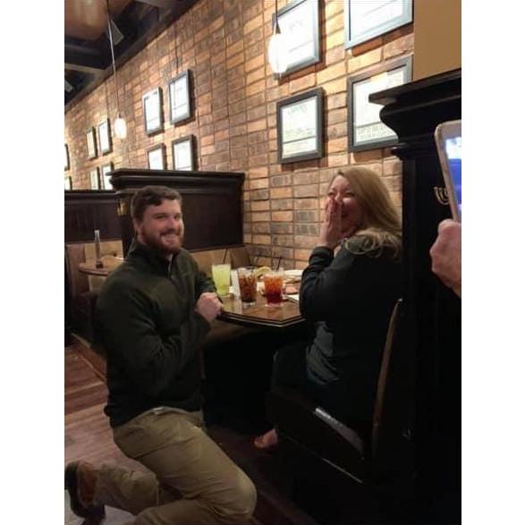 Taylor completely surprised JoEllyn on their 3rd anniversary by proposing and sneaking all their parents into Malone's