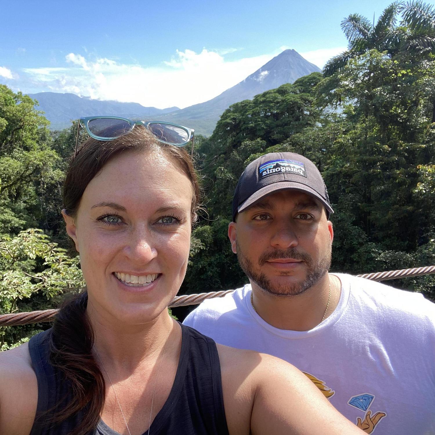 Costa Rica, round 1. Standing on a suspension bridge with the Arenal Volcano in the background.