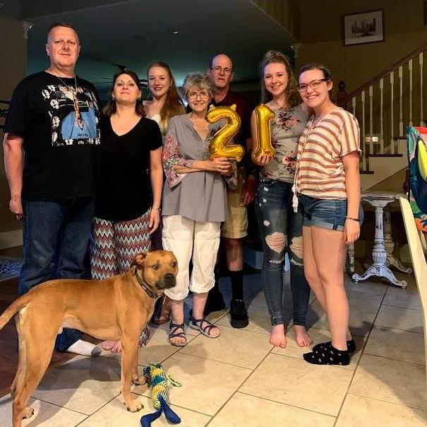 Abbi's 21st birthday with family. (Left to Right: Dad, Mama, Alyssa, Nana, Papa, Abbi, Julia, and Cooper in the front)