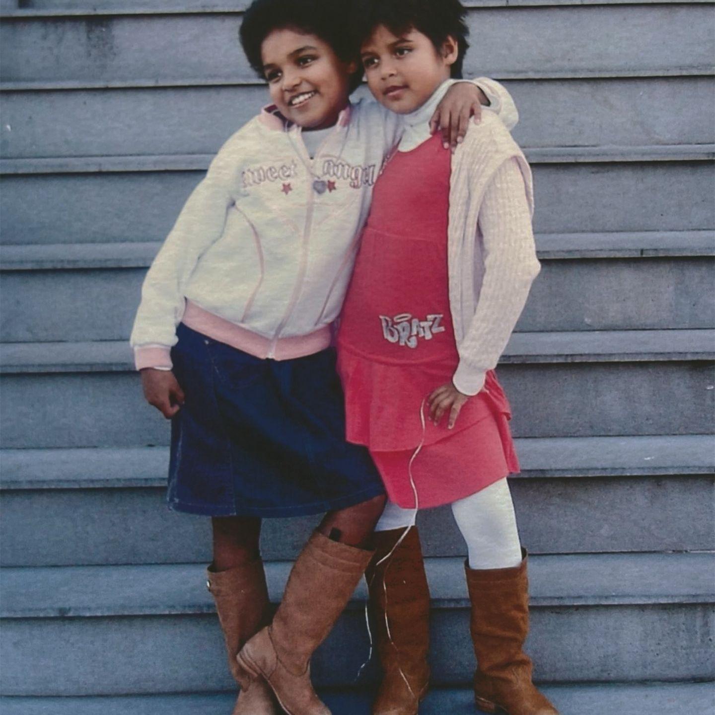 Debbie & her sister Patricia after being adopted by their French families in Brazil.