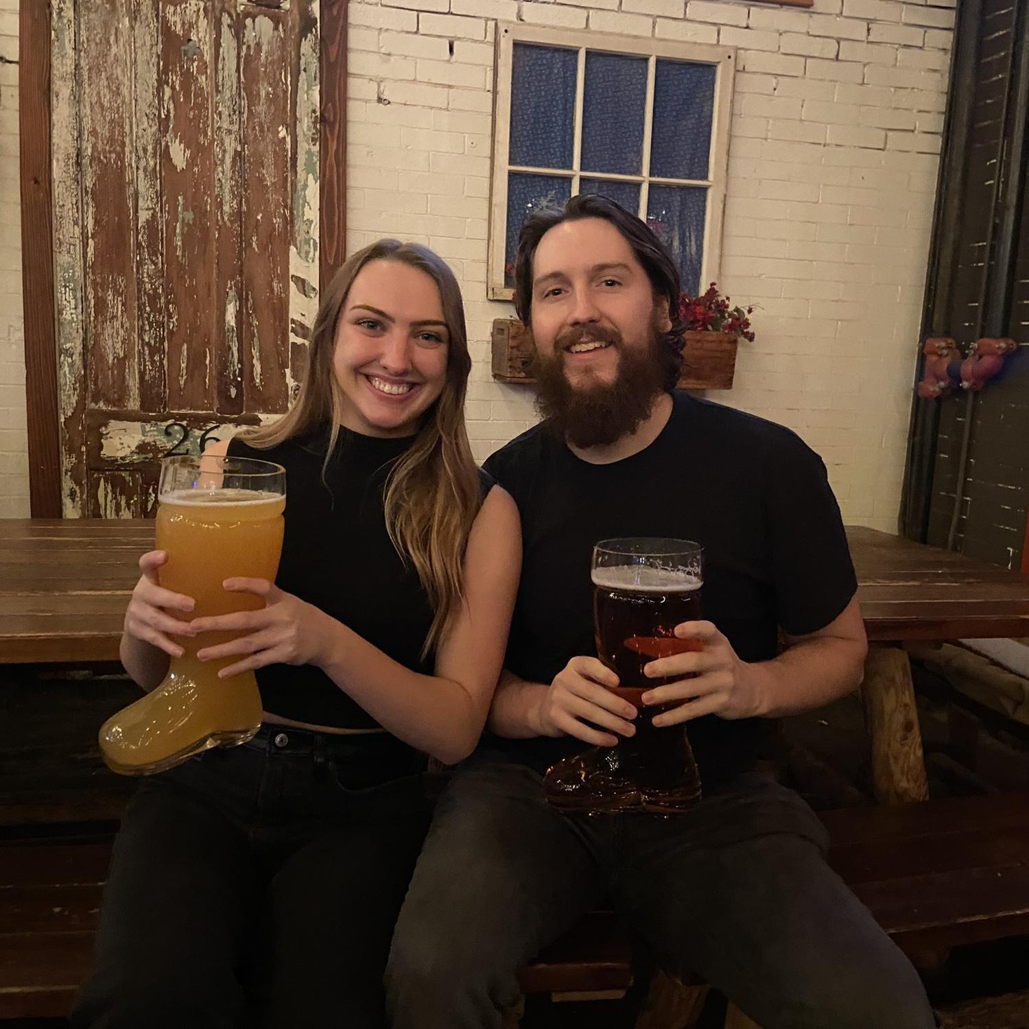 Enjoying our boots together at Biergarten for our birthdays