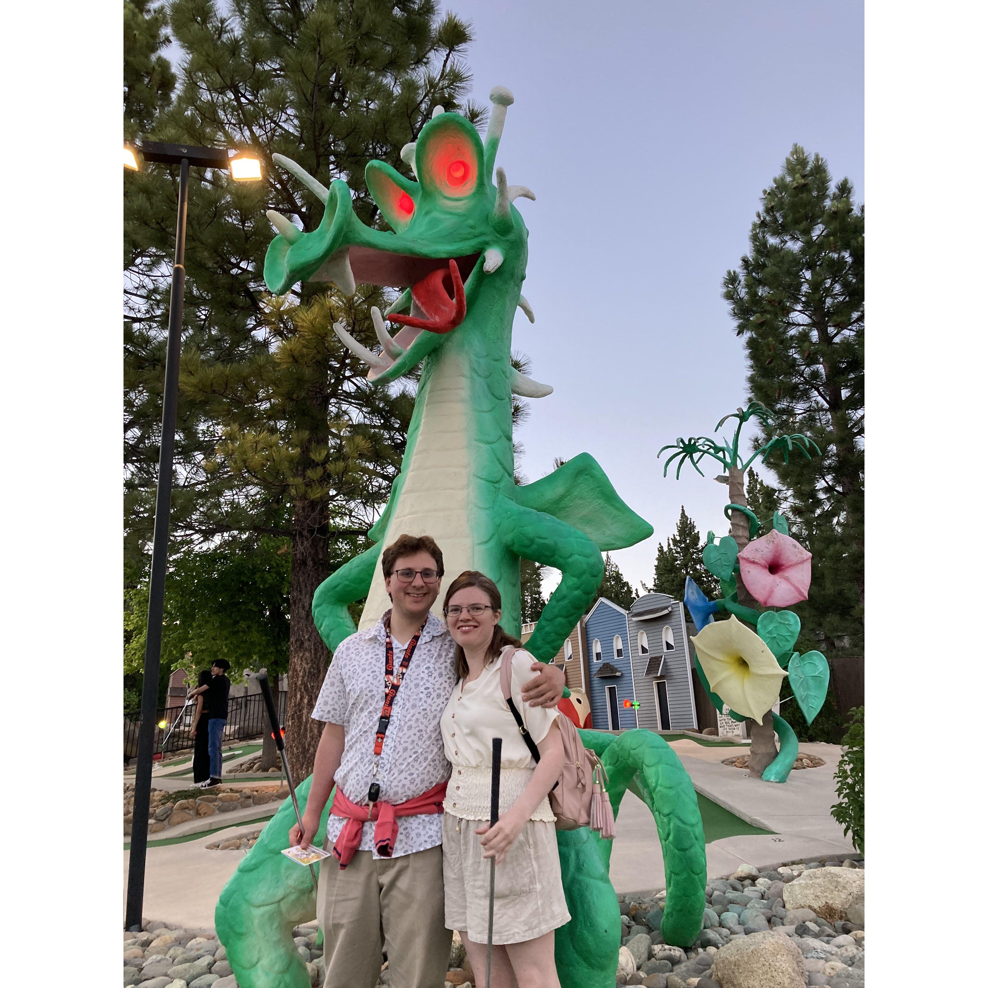 I do not know which is scarier: This dragon, or Emily's minigolf tee off.