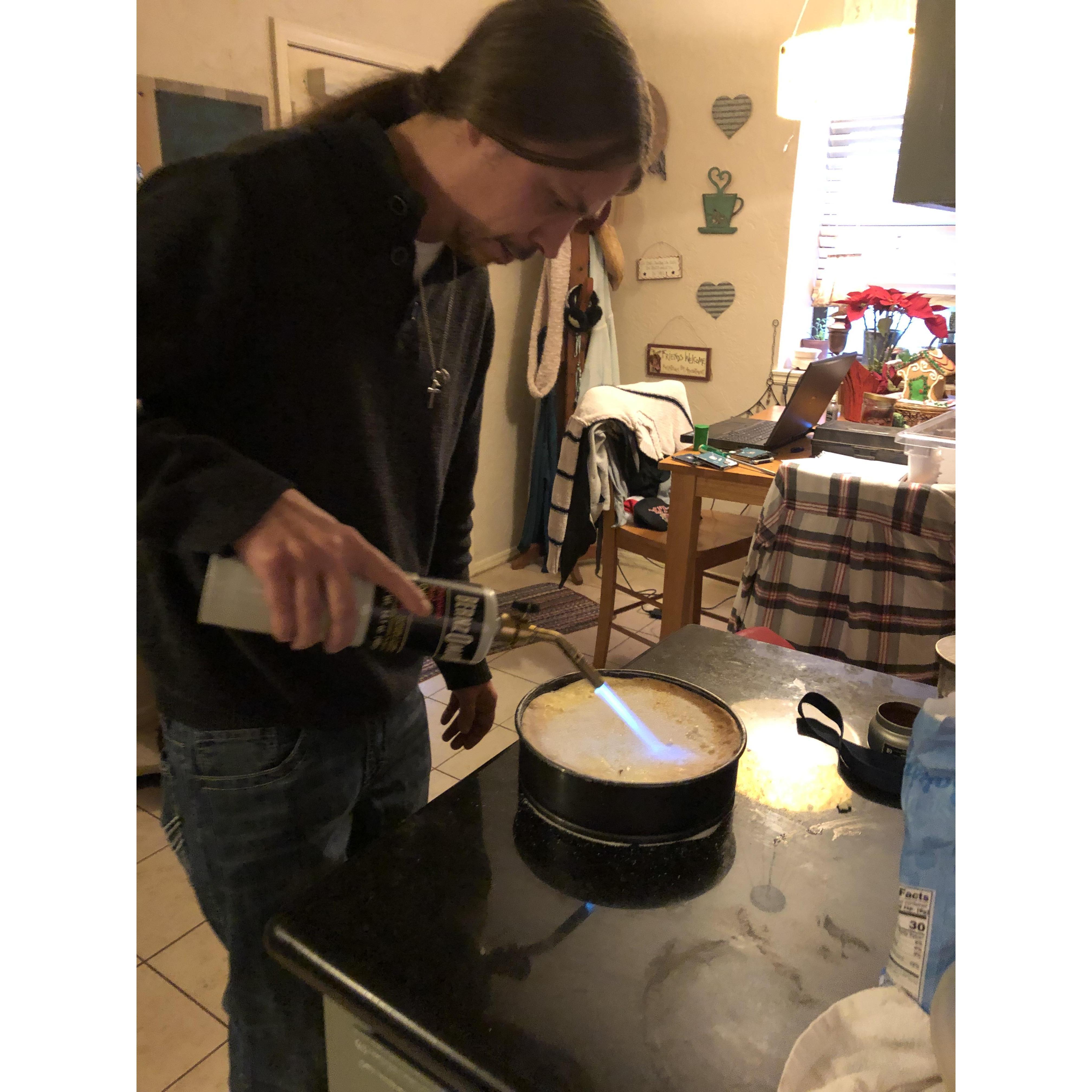 Greg making his famous creme brulee for Christmas.