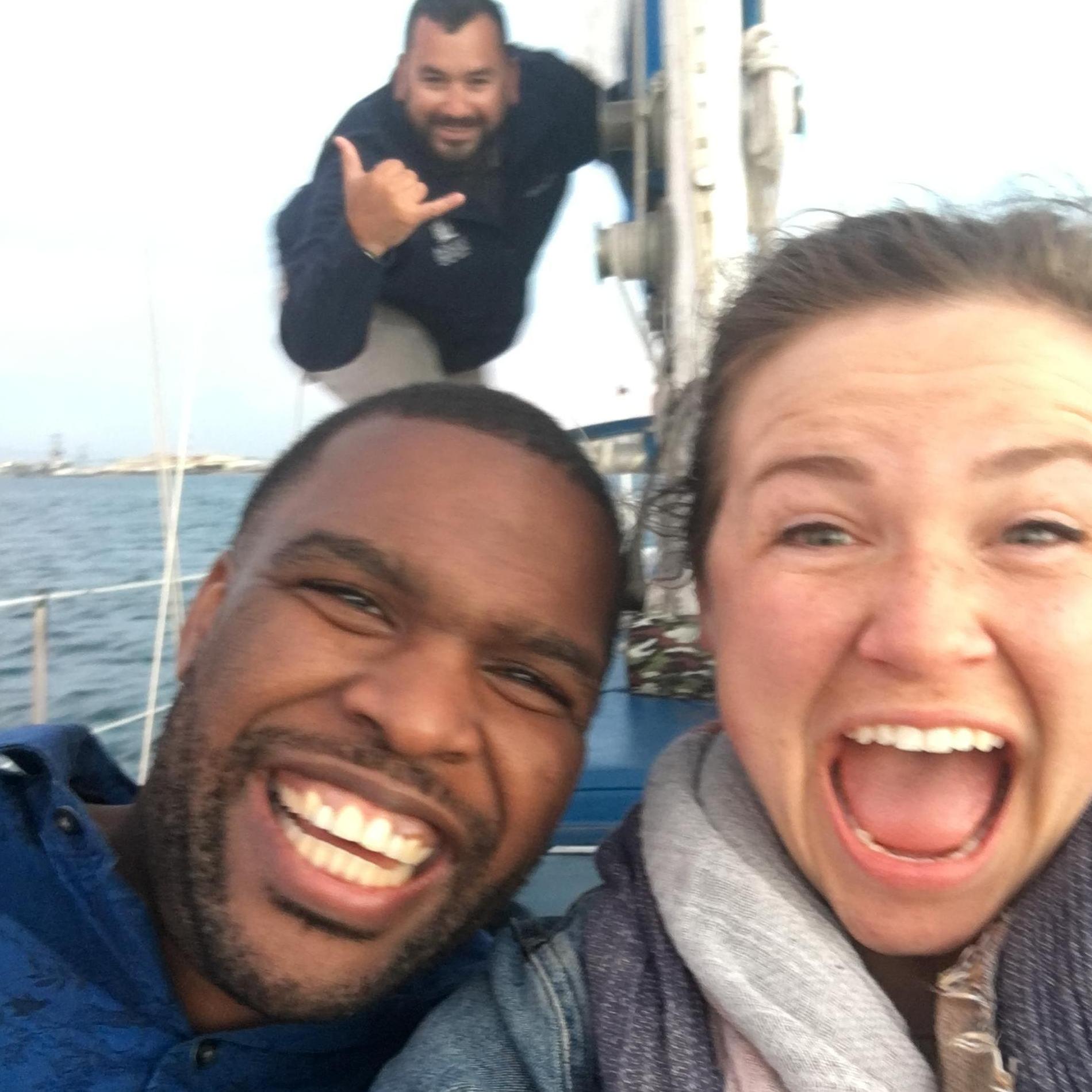 Me freeeaaking out that we are engaged (blurry photo and all) with our amazing captain in the background that took so many photos for us<3