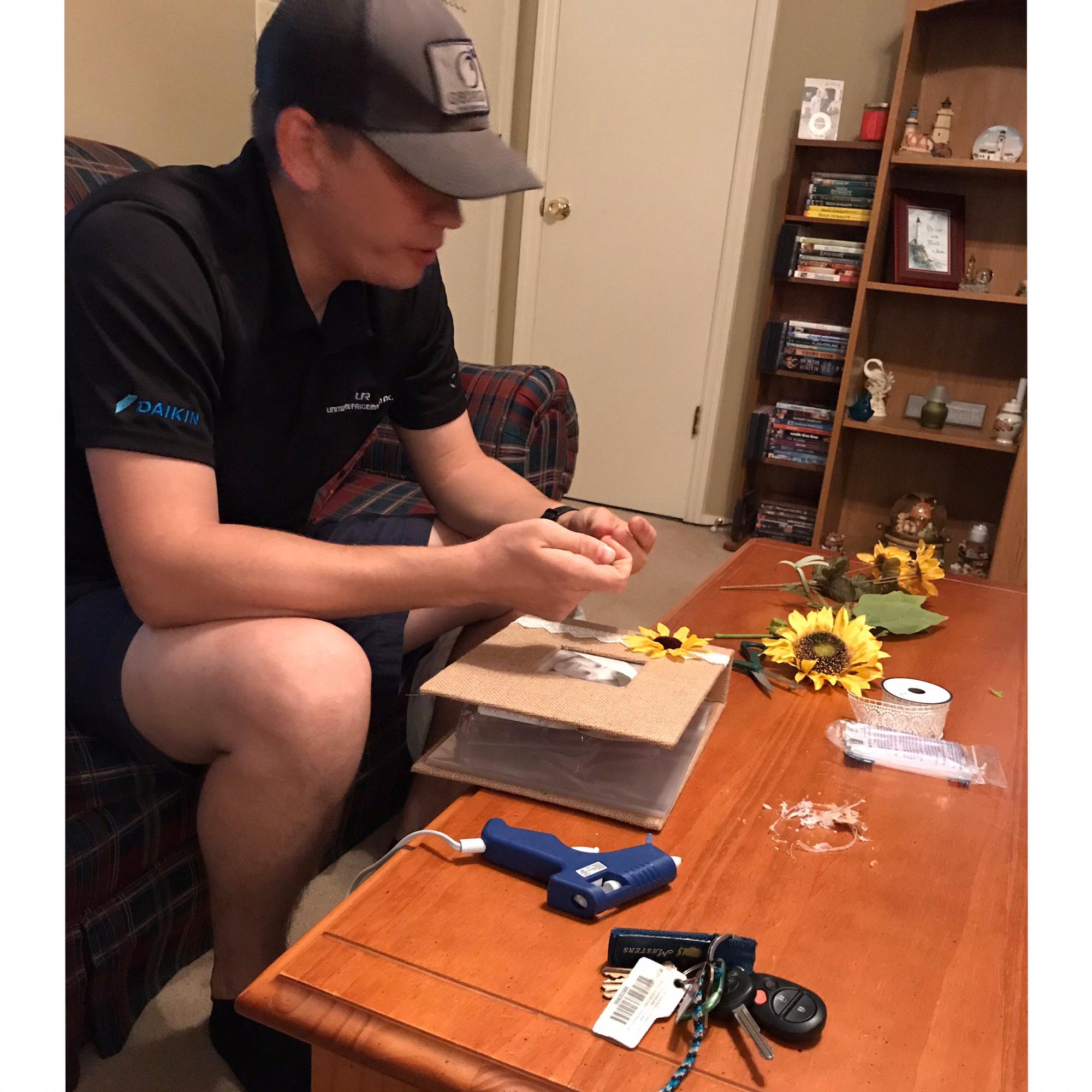 Ryan making a scrapbook to use to propose with, September 5, 2019.