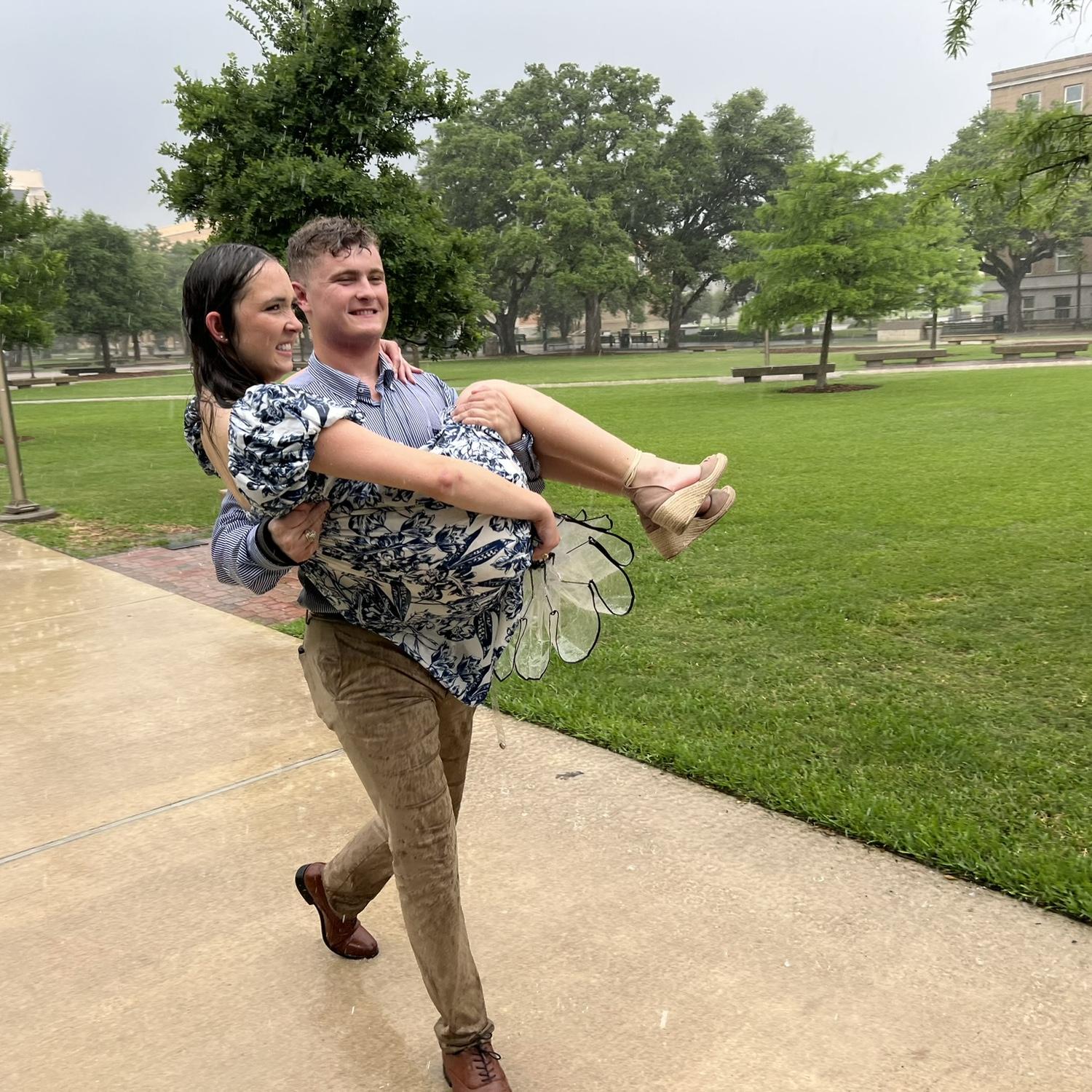 Carrying me to the car to get out of the rain