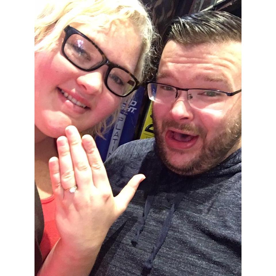 In a little bar in Nashville, TN called Tootsies a cover band was playing a tune called "Check Yes or No". That is where Sam asked his best friend to be his wife and she "checked yes"!