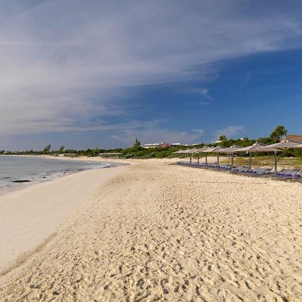 The beach is private for resort guests only.  They also have full food and beverage service on the beaches!