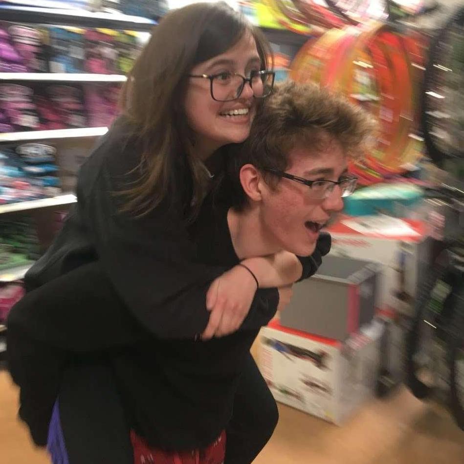 Taken at a Walmart near Front Royal, VA 3 months after we started dating. Max was running full speed at another of our friends, which is why Jade looks so terrified - real fear. A historic pic.