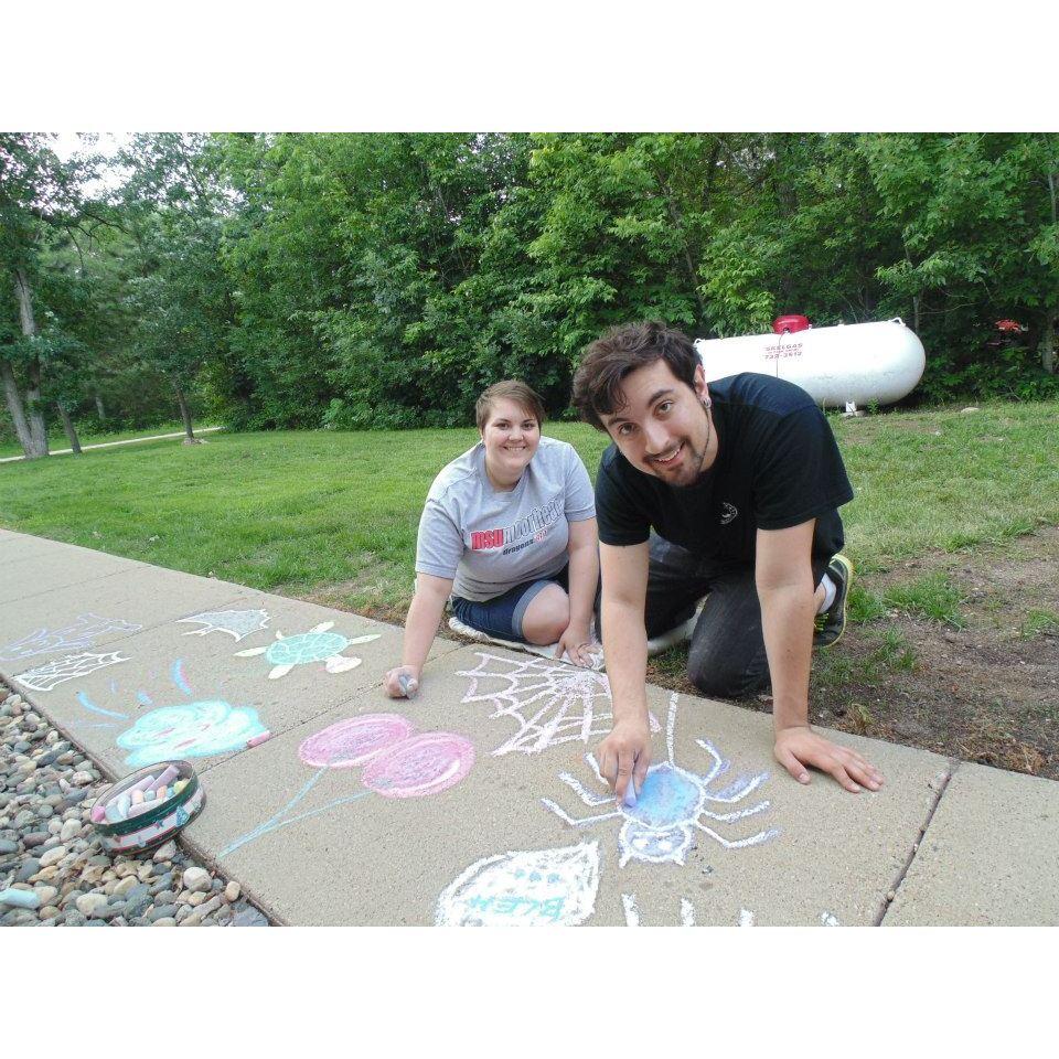 Drawing with chalk on Gena's sidewalk in Menahga, MN