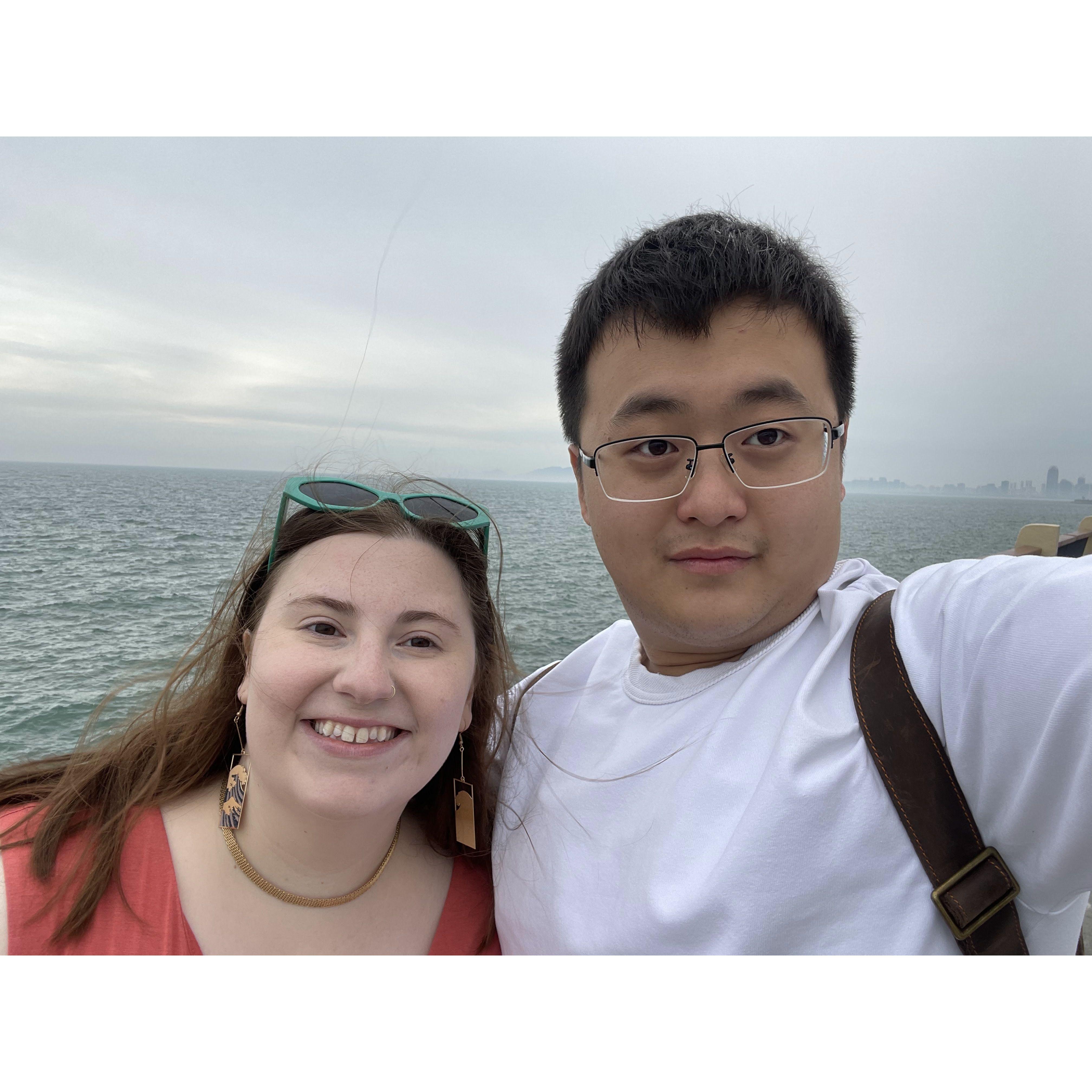 Allison and Haonan by the sea after walking the entire circumference of Star Island in Qingdao, Shandong Province, China.