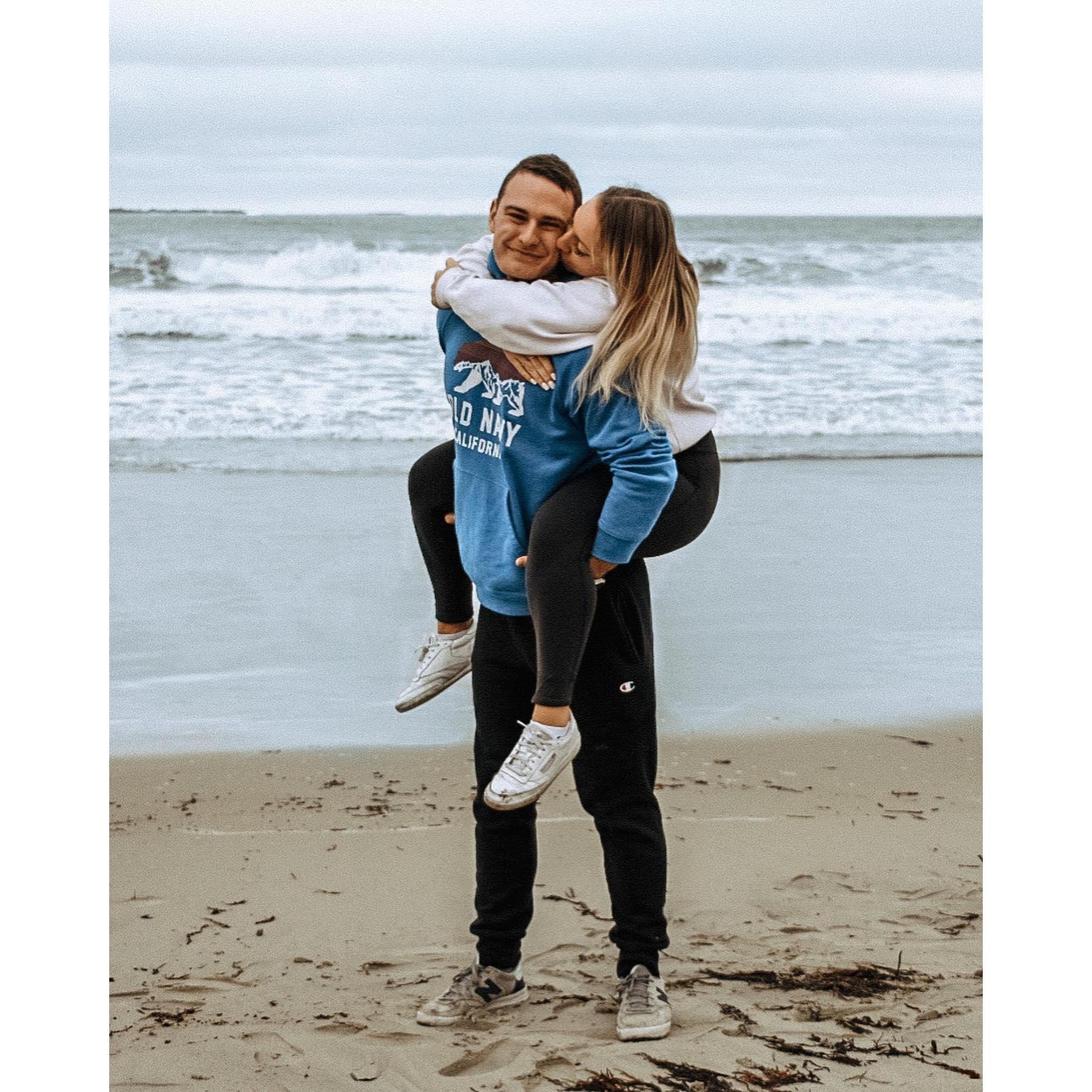 October 28, 2018: The first picture ever taken of Shea and Brad. The photographer was Brad's best man, Julio, and they were on the beach where Brad grew up in Old Orchard Beach, ME.