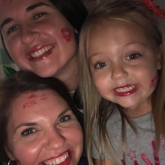 One of our first family pics … Evelyn loves to play Lipstick Kisses!