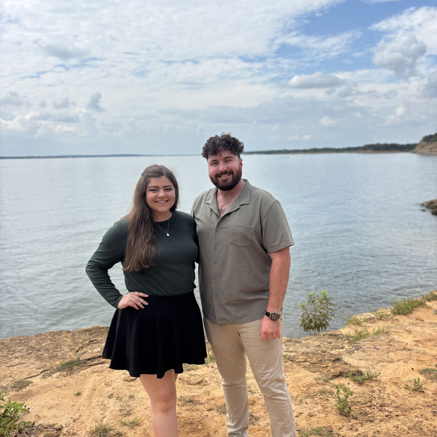 Megan unsuspectingly taking pictures before Zack popped the question