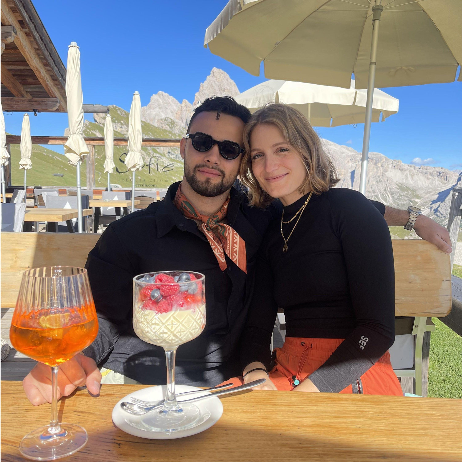 This photo perfectly portrays the different needs we have after a 10-mile hike, one wants an Aperol spritz, the other gelato and berries!