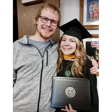 Katie's graduation with her Master's degree in December 2023.