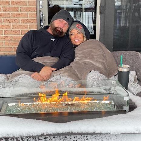 Enjoining the first snowfall on the deck by the fire