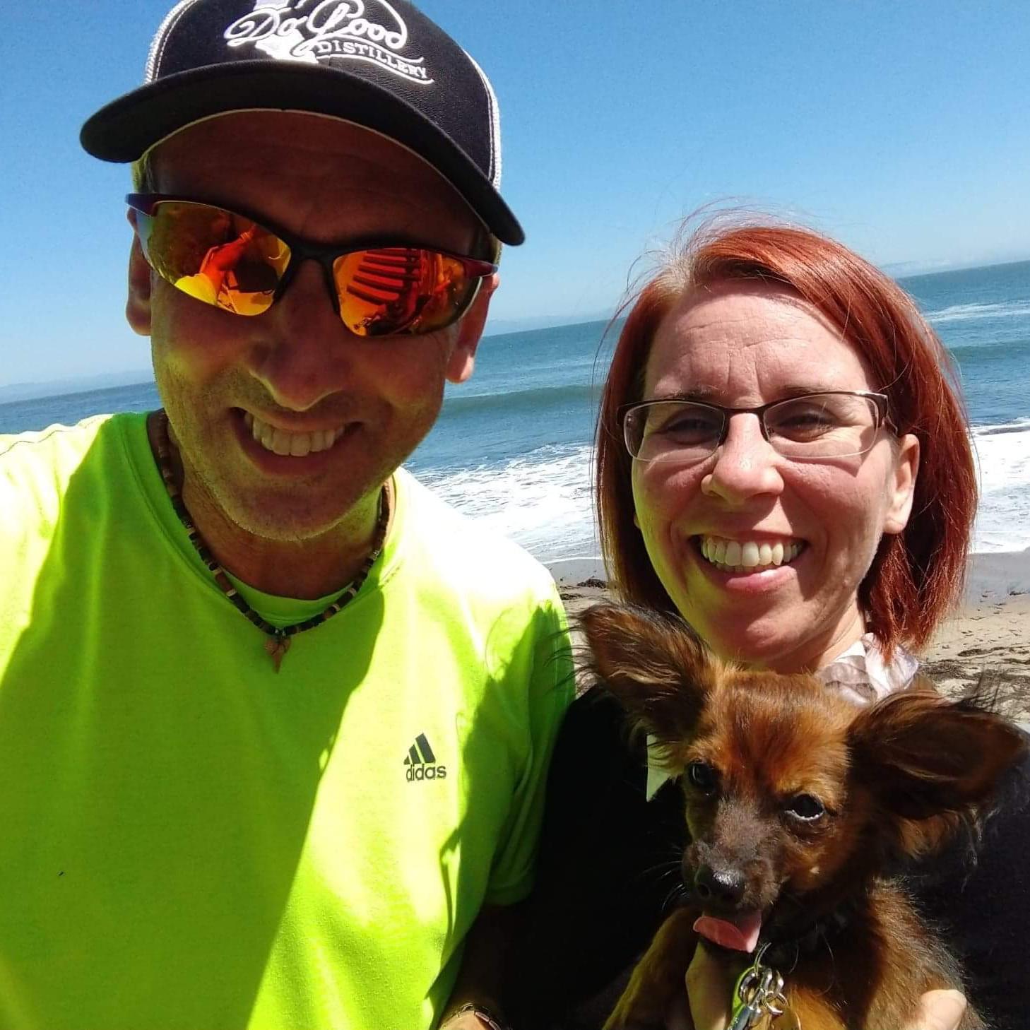 On the beach near Santa Cruz with our little pomchi Roscoe.