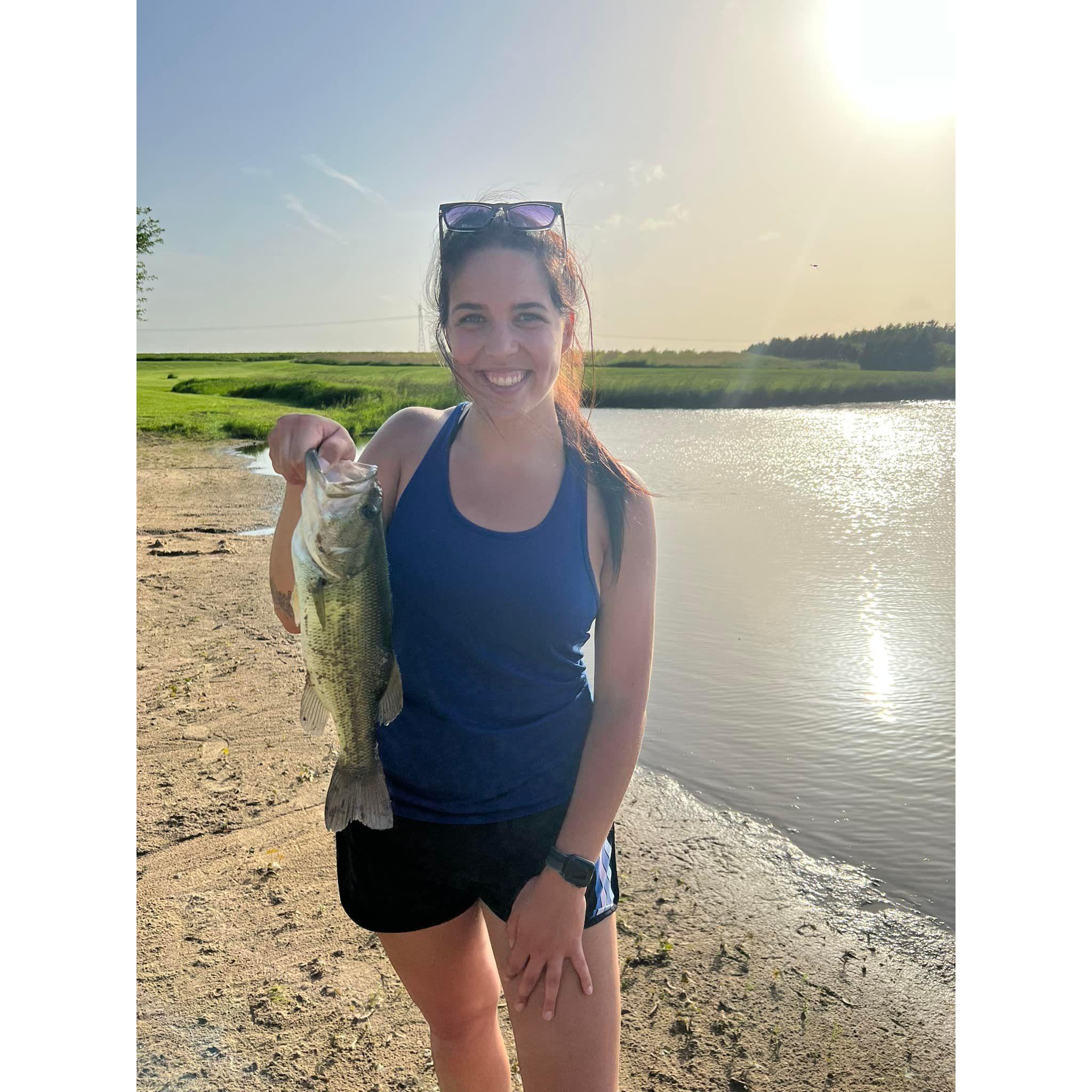 Showing off a big catch while on a fishing date together.