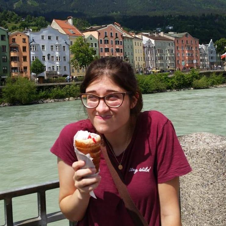 May 21, 2018: Caitlyn standing by the Inn river and enjoying a frozen yogurt in a fluffy pastry cone.
