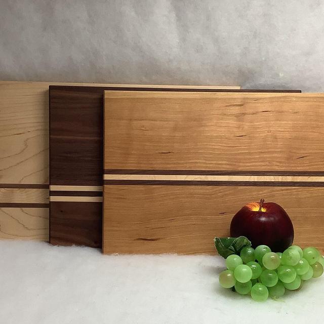 Made in Maine, Beautiful hand made cutting board with contrasting stripes. 9” x 14”