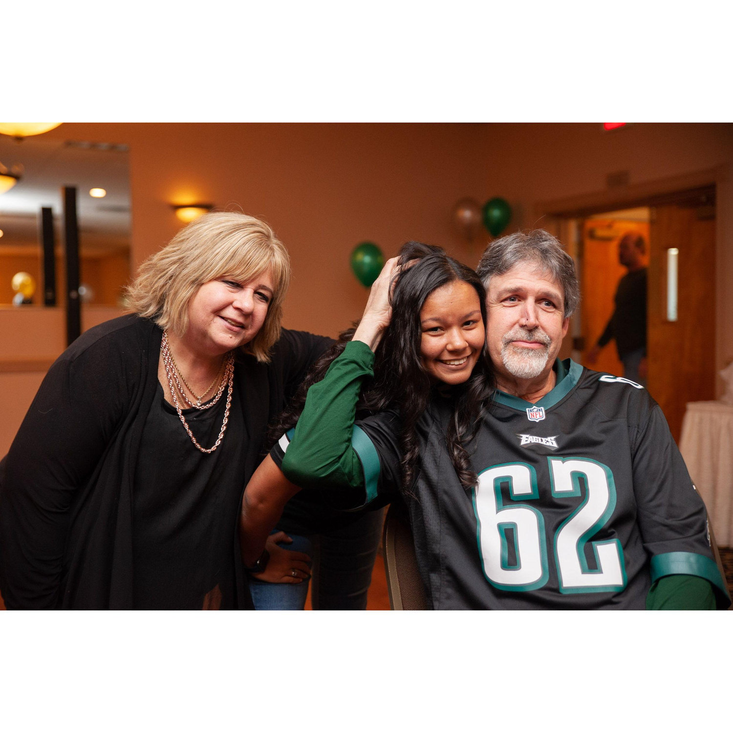 Lindsay with her mom, Anita and her dad, Karl at Karl's Surprise 60th Birthday party April 2022