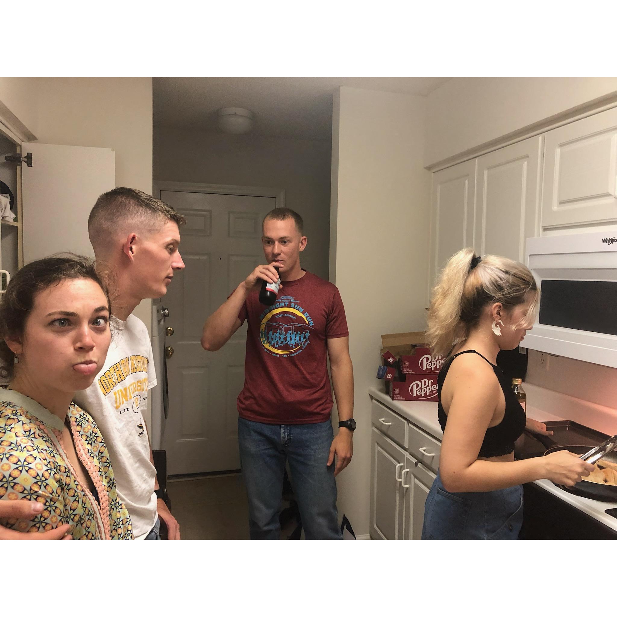 MB, Anthony, Bill, and Kate are enjoying a fun evening of games and Kate's delicious cooking!