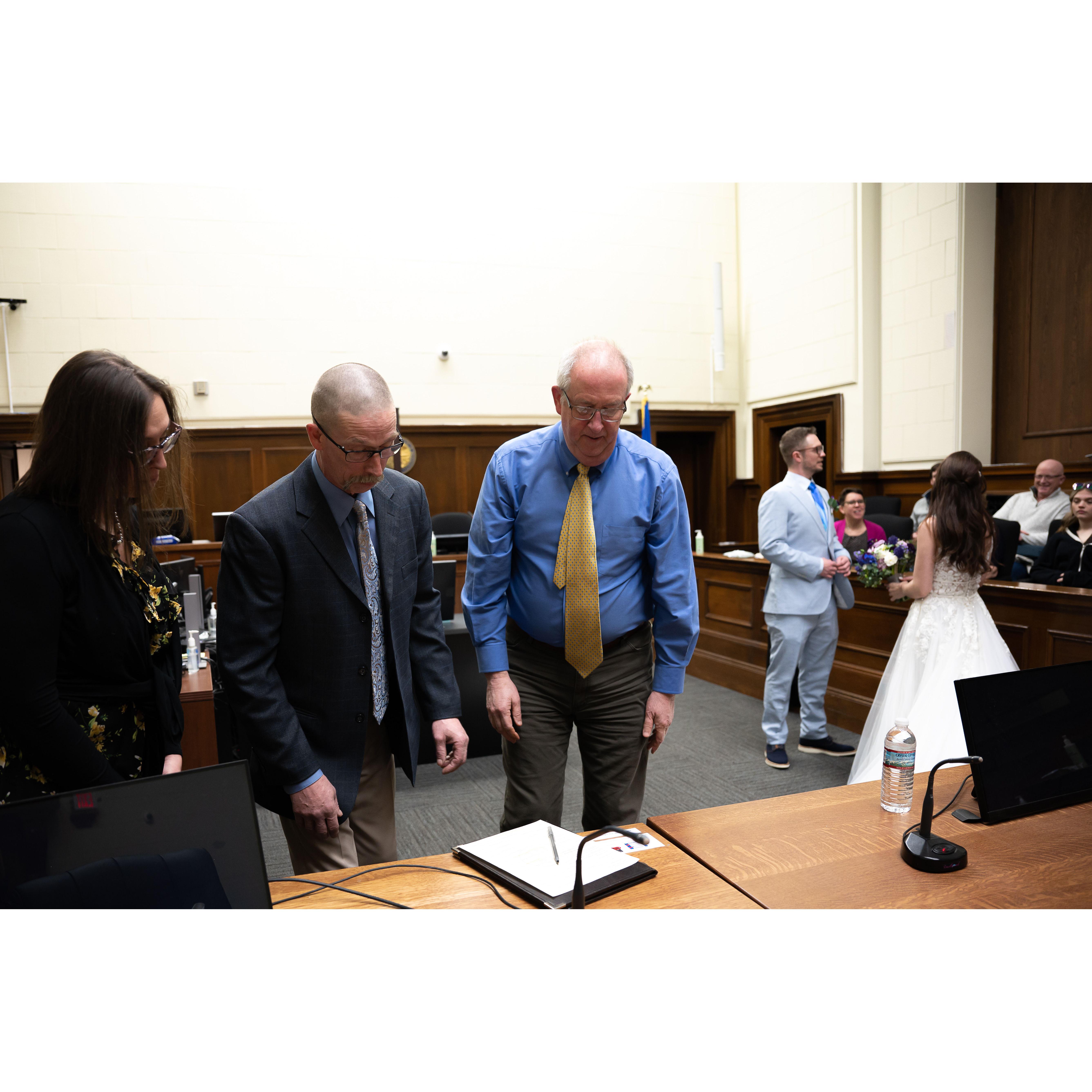 Our witnesses Bob and Kate about to sign our marriage certificate