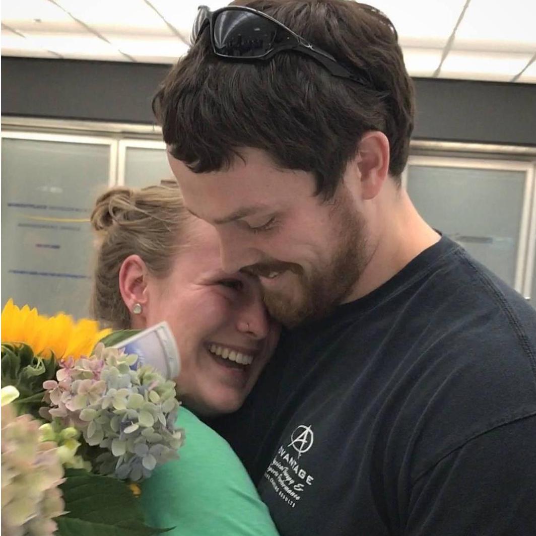 TJ surprises Kira at the airport after her summer in Alaska