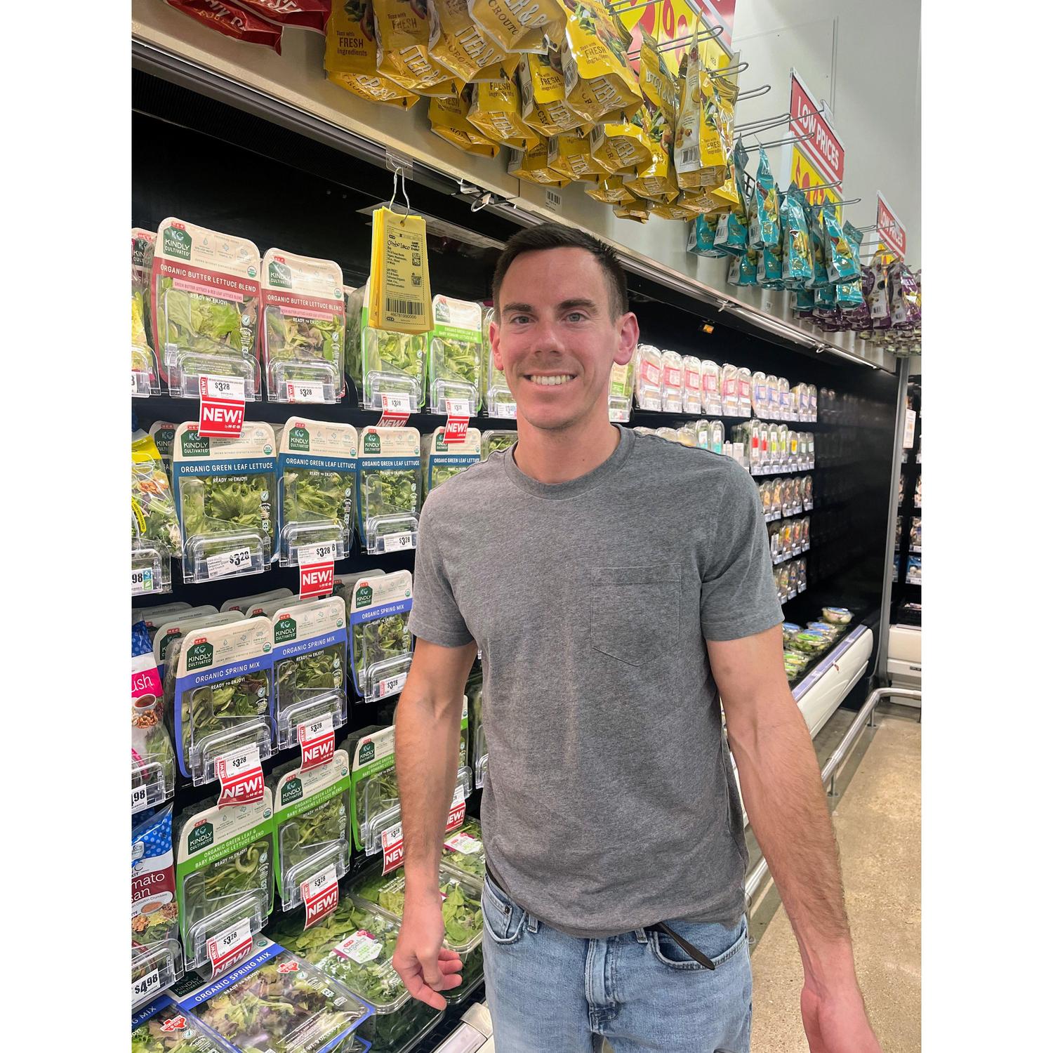 July 2023: Taylor posing with the Revol Greens product at the local HEB!