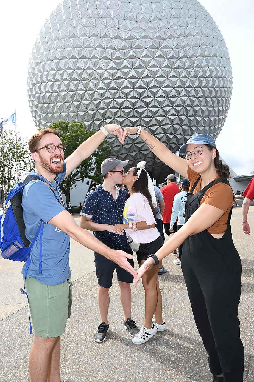 Get you friends who will help you pretend you just got engaged at Disney World.