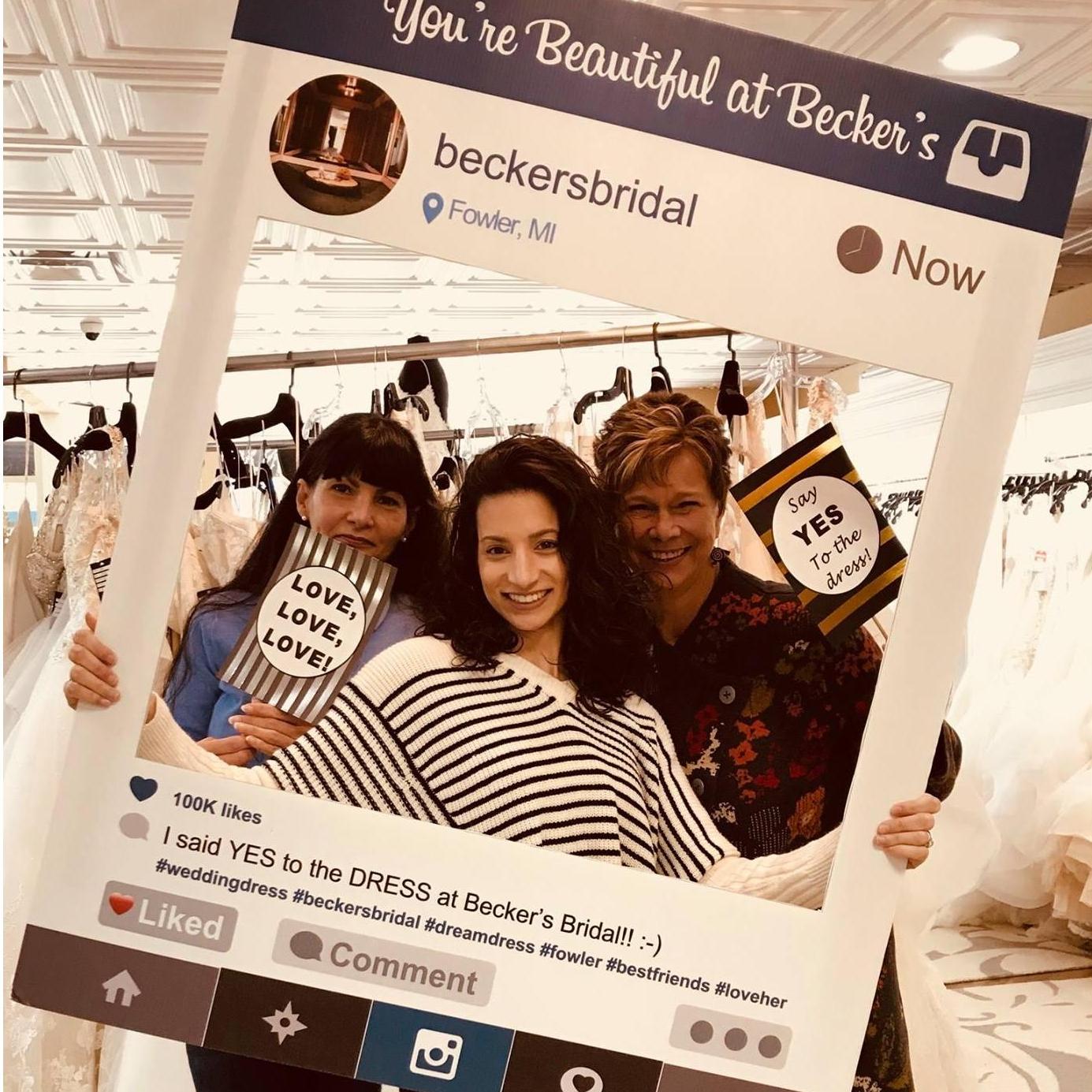I said, "Yes!" to the dress with our mothers. - Photo by Becker's Bridal