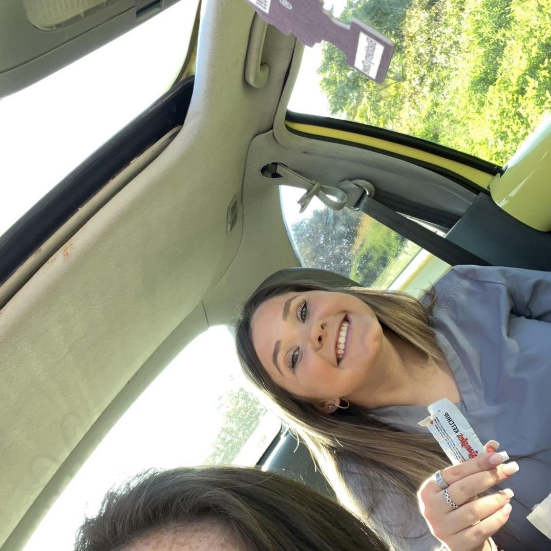 July 2022: First "date" Bojangles parking lot after a long night shift of work, and Baleigh captured this picture of Morgan- ketchup in hand!