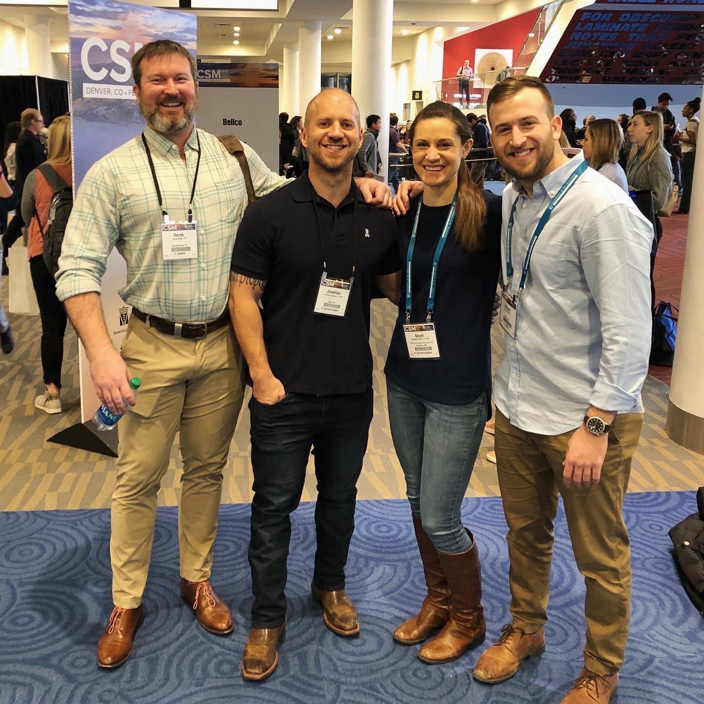 Steph & Zak, in true nerd fashion, hanging with two of their mentors at a physical therapy conference