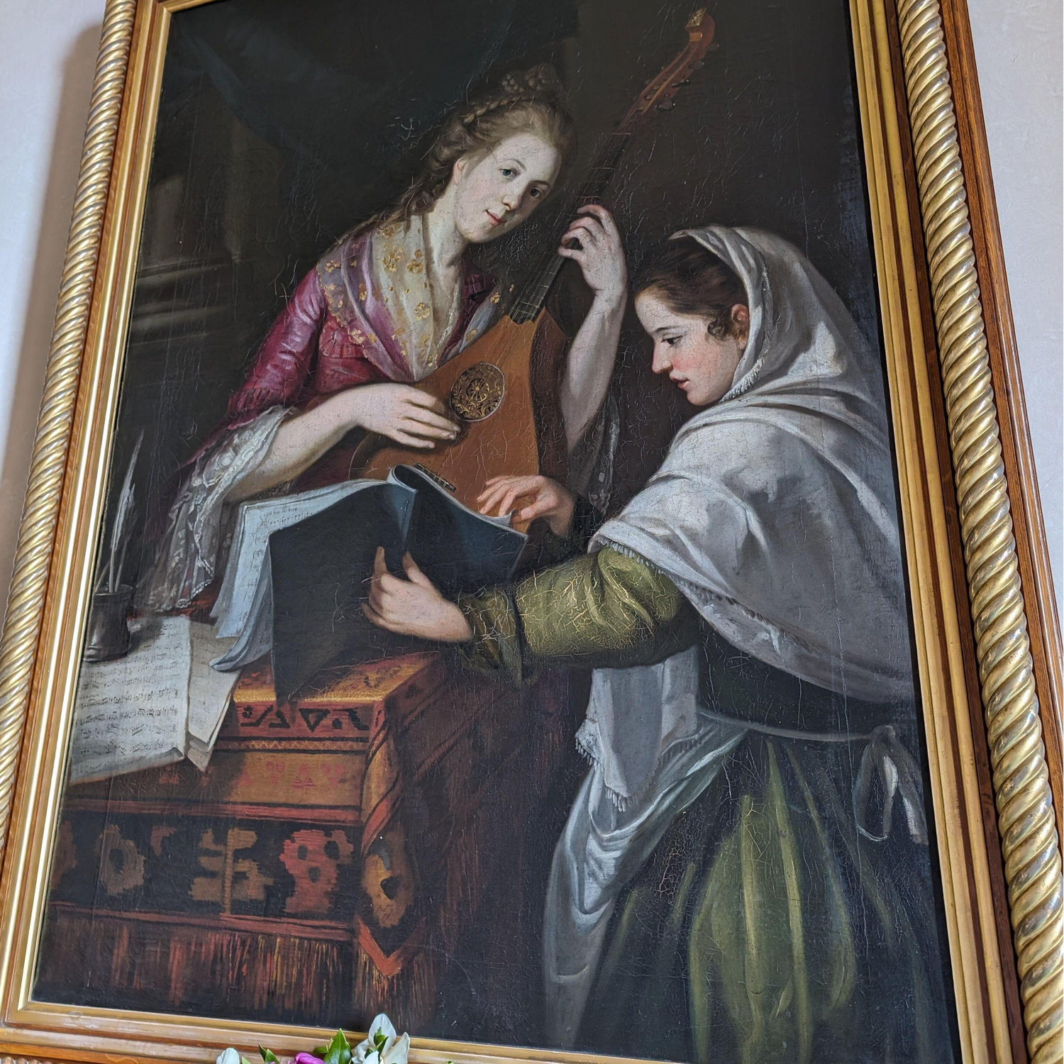 A Lady with her handmaiden, practicing a stringed instrument.