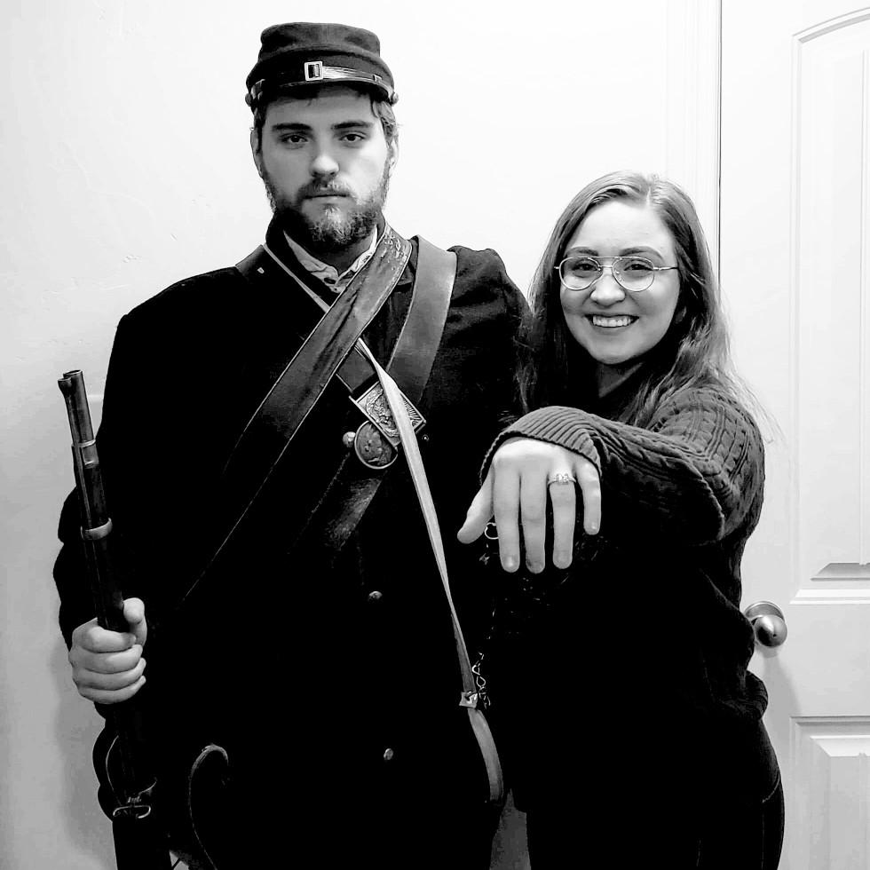Bryce proposed on New Year's Eve. On New Year day we went to our old roomate family dinner and his dad had Civil War reenactment gear. We had yet to take our announcement picture so we thought, why not?