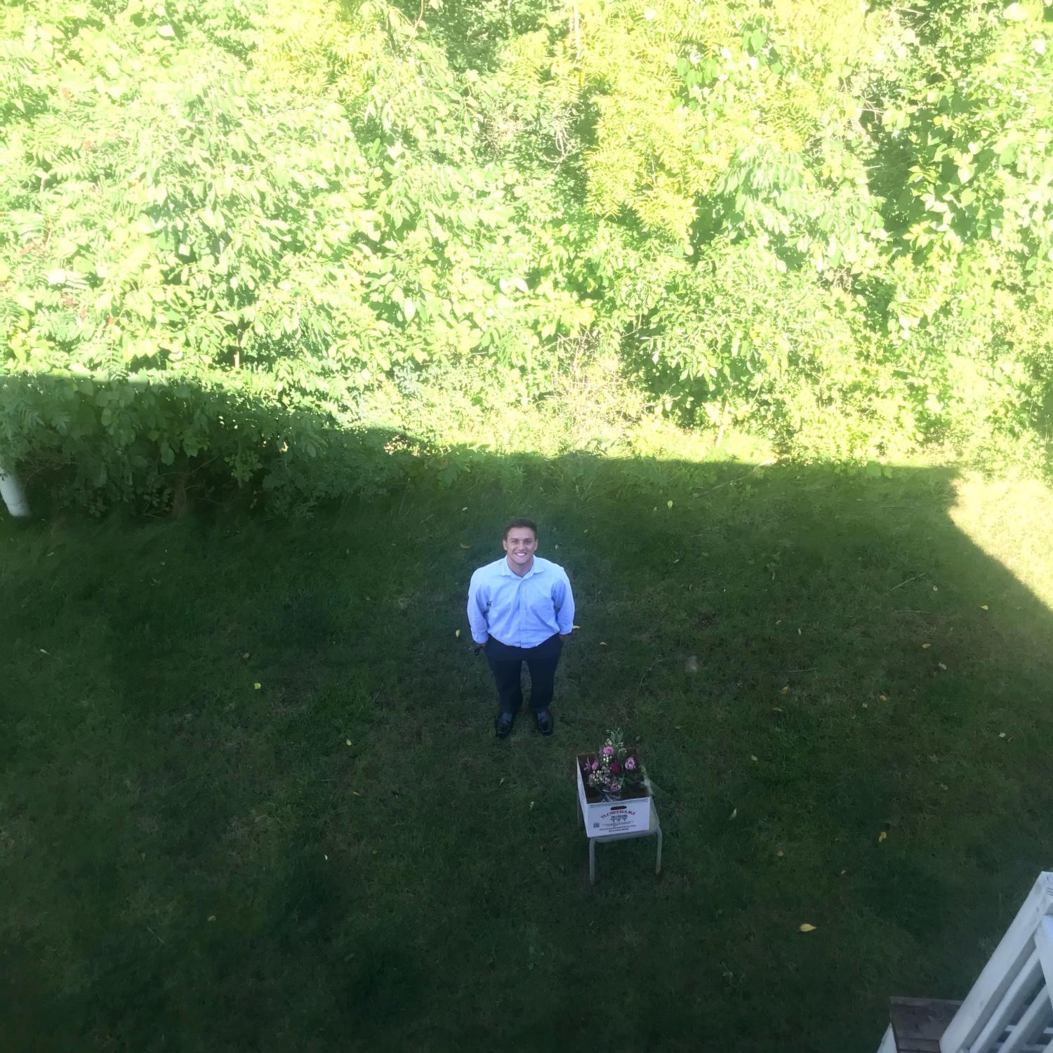 2020 - Mark bringing Emma flowers and talking to her through the window when she was stuck inside with COVID