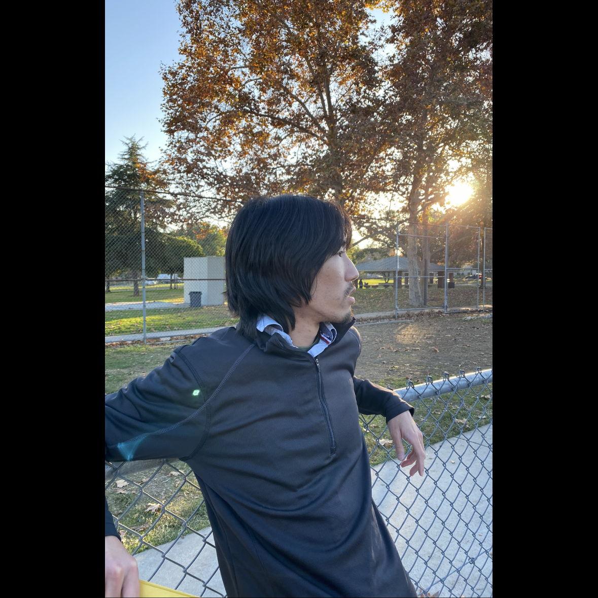 Coach Mitchell Kodama watching over the JV waiting to start their warm up. Captured by Assistant JV Coach Milla Almaraz.     December 2023