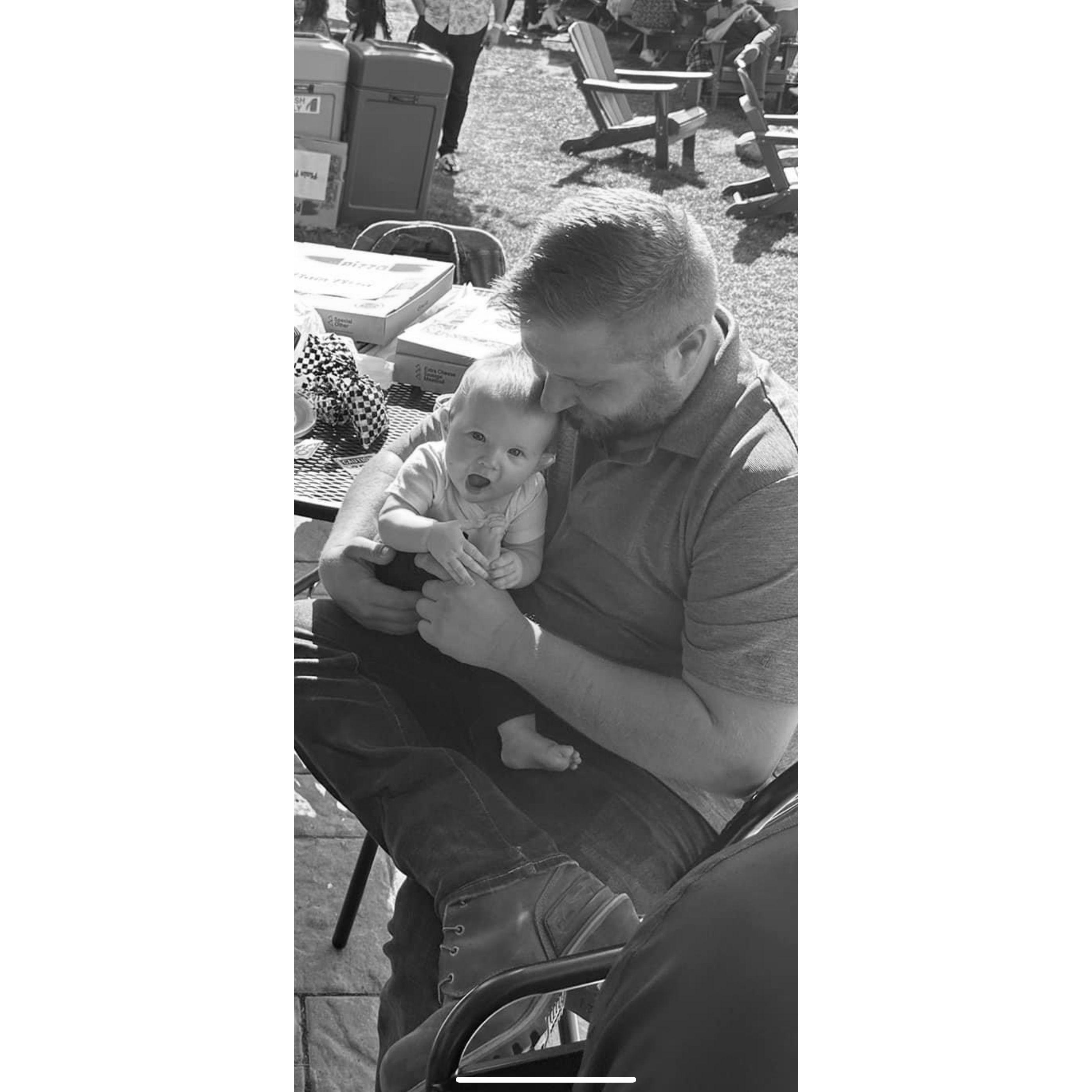 Riley exploring her toes with Lee!