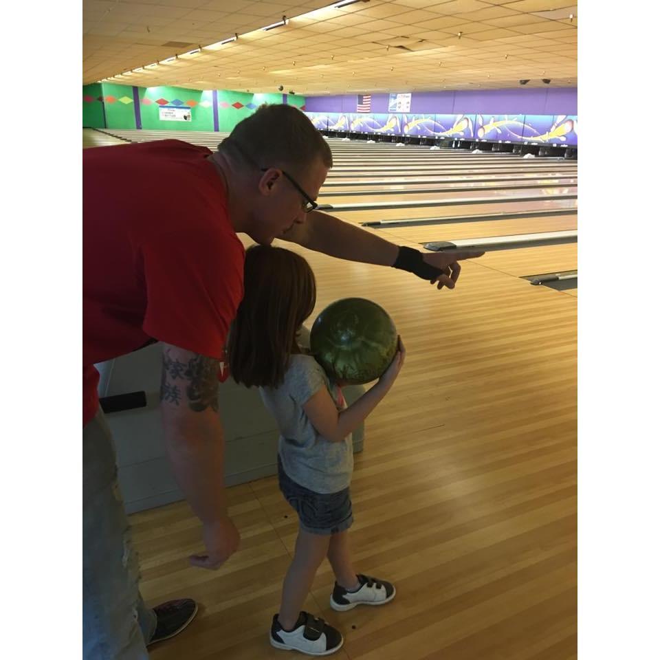 Tommy teaching Riley to bowl!