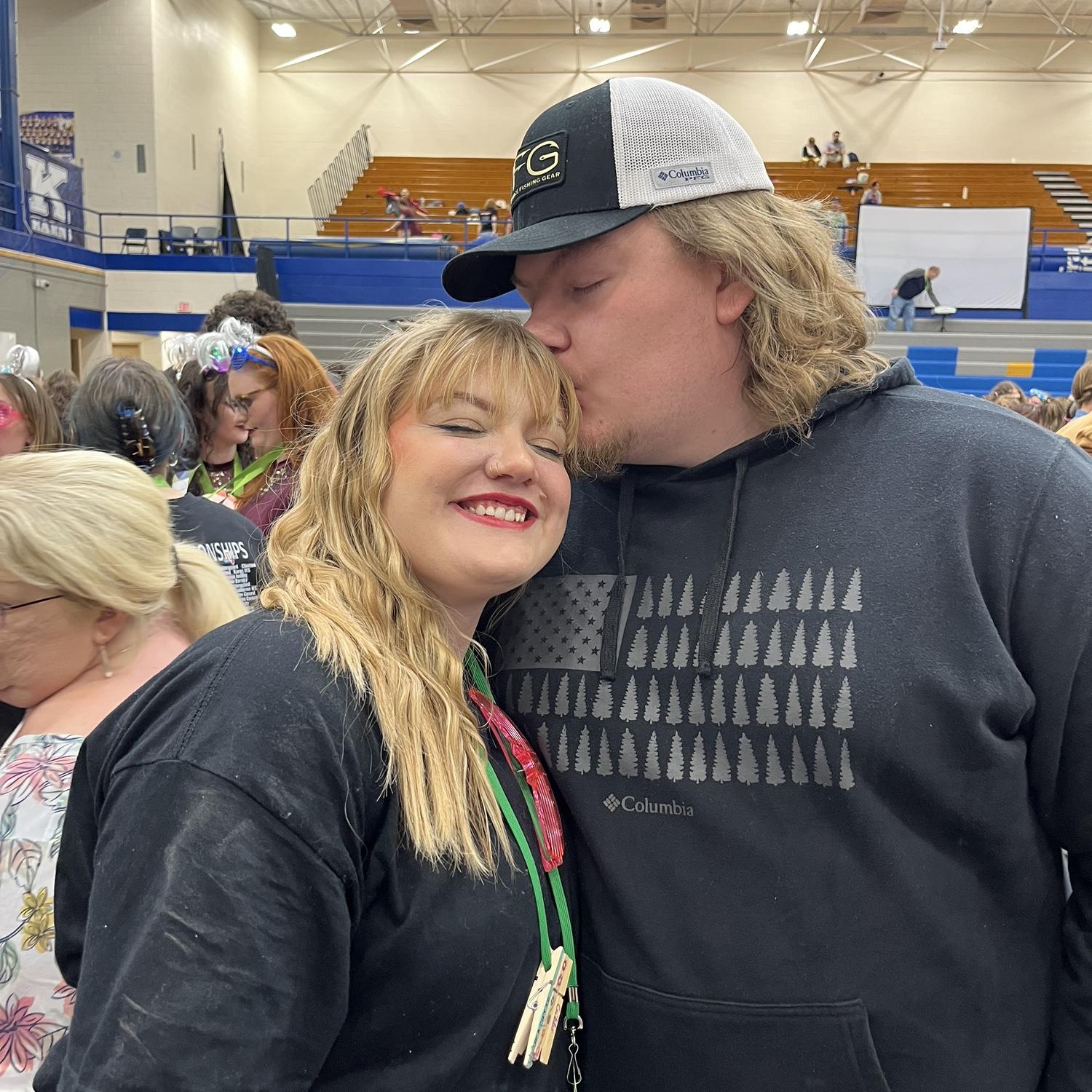 Emma's colorguard team won the gold medal in the championship. Brock came after work to support her and the kids.