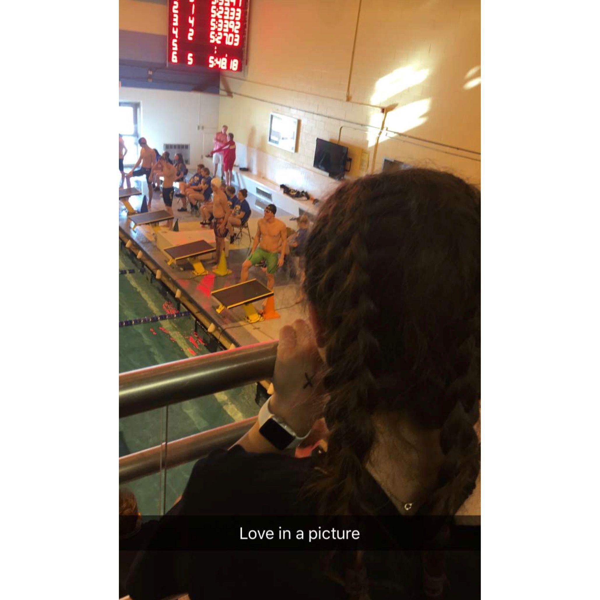 Rowan's teammate took this photo as a joke the day we first got to meet in person at a swim meet. Our towns/swim teams were an hour apart, so it wasn't easy to try dating, so we just talked a lot.