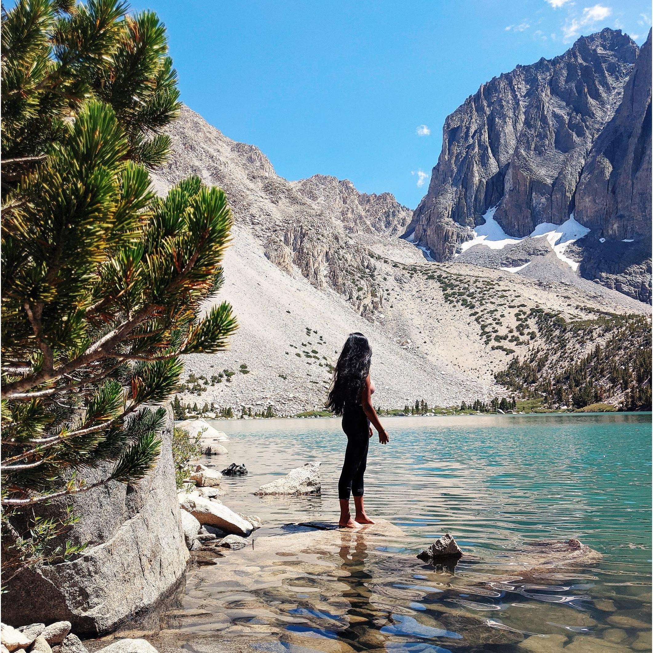 While Ash is in grad school, weekends away have been harder to come by. Still, adventure is medicine for her soul. Here's Ash admiring an alpine lake in the High Sierras.