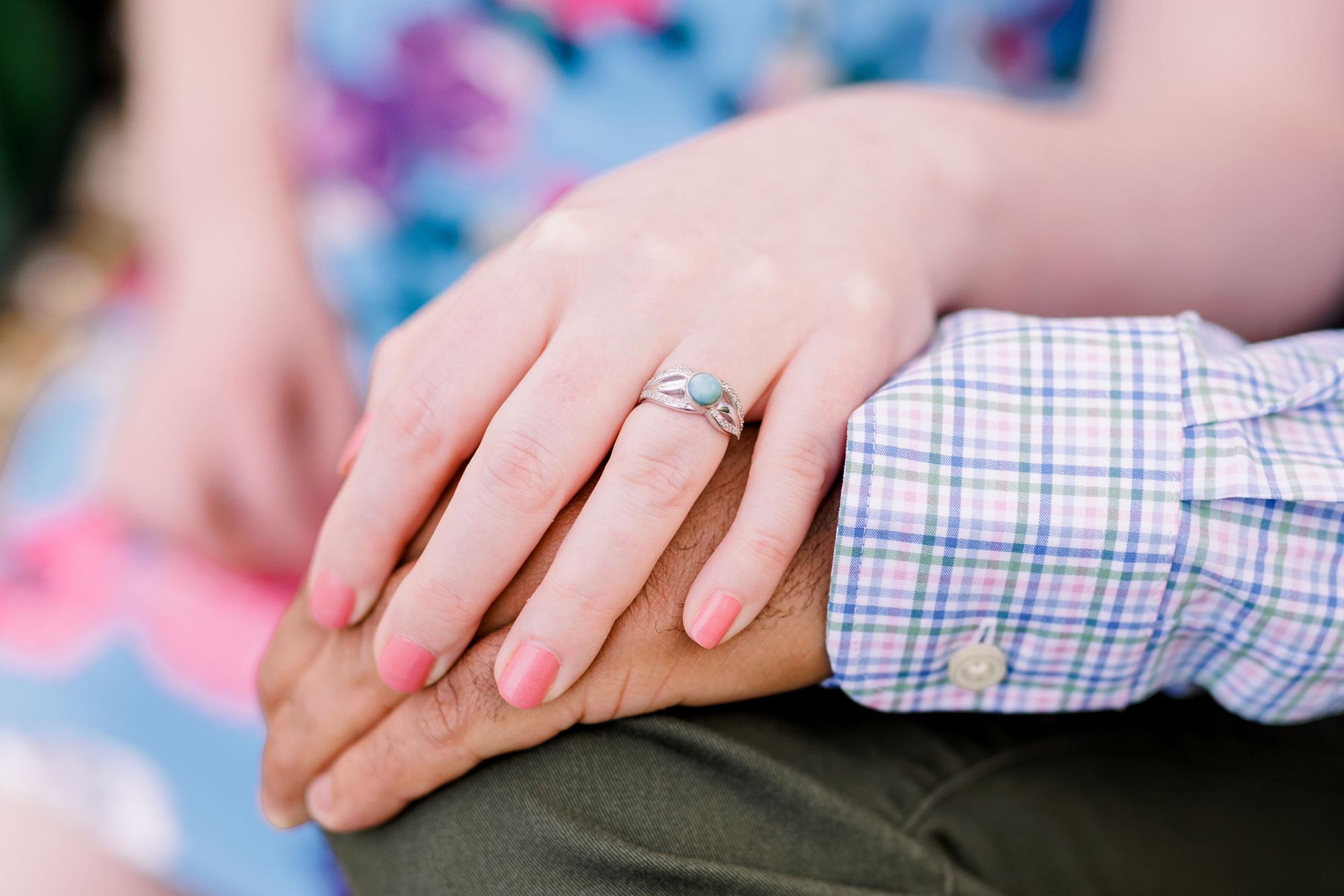 A ring designed by the couple! Using Larimar, a gemstone only found in the Dominican Republic, and a family ring setting!