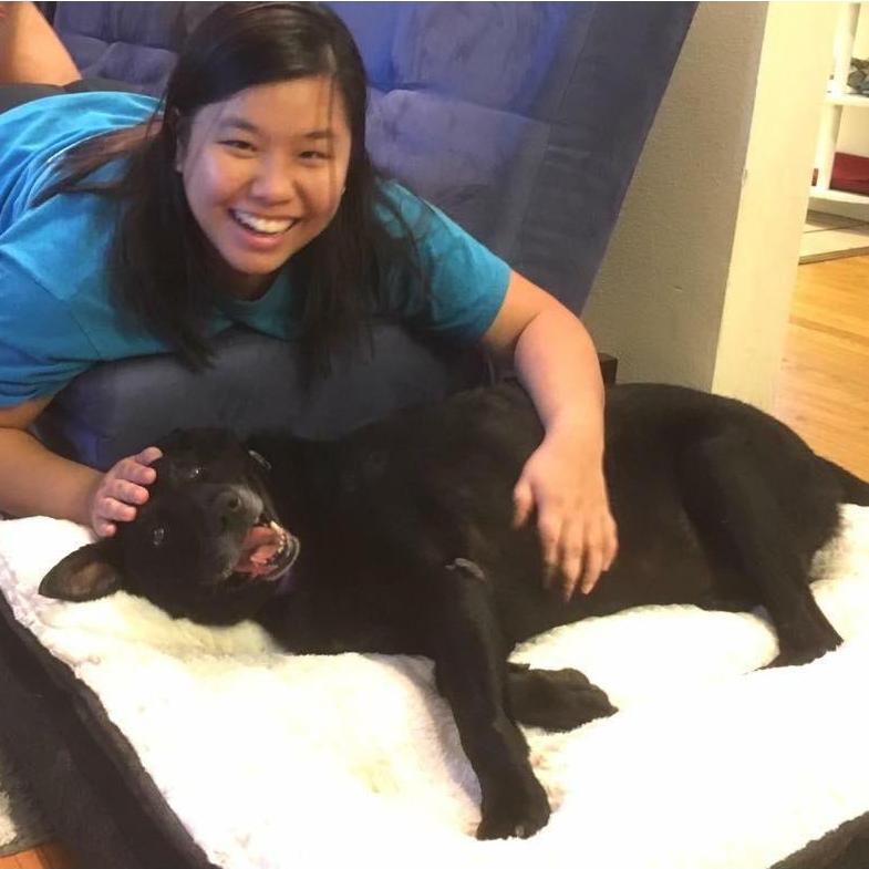 Liana playing with then six-year-old Bella, right after bringing her home from the shelter in 2016