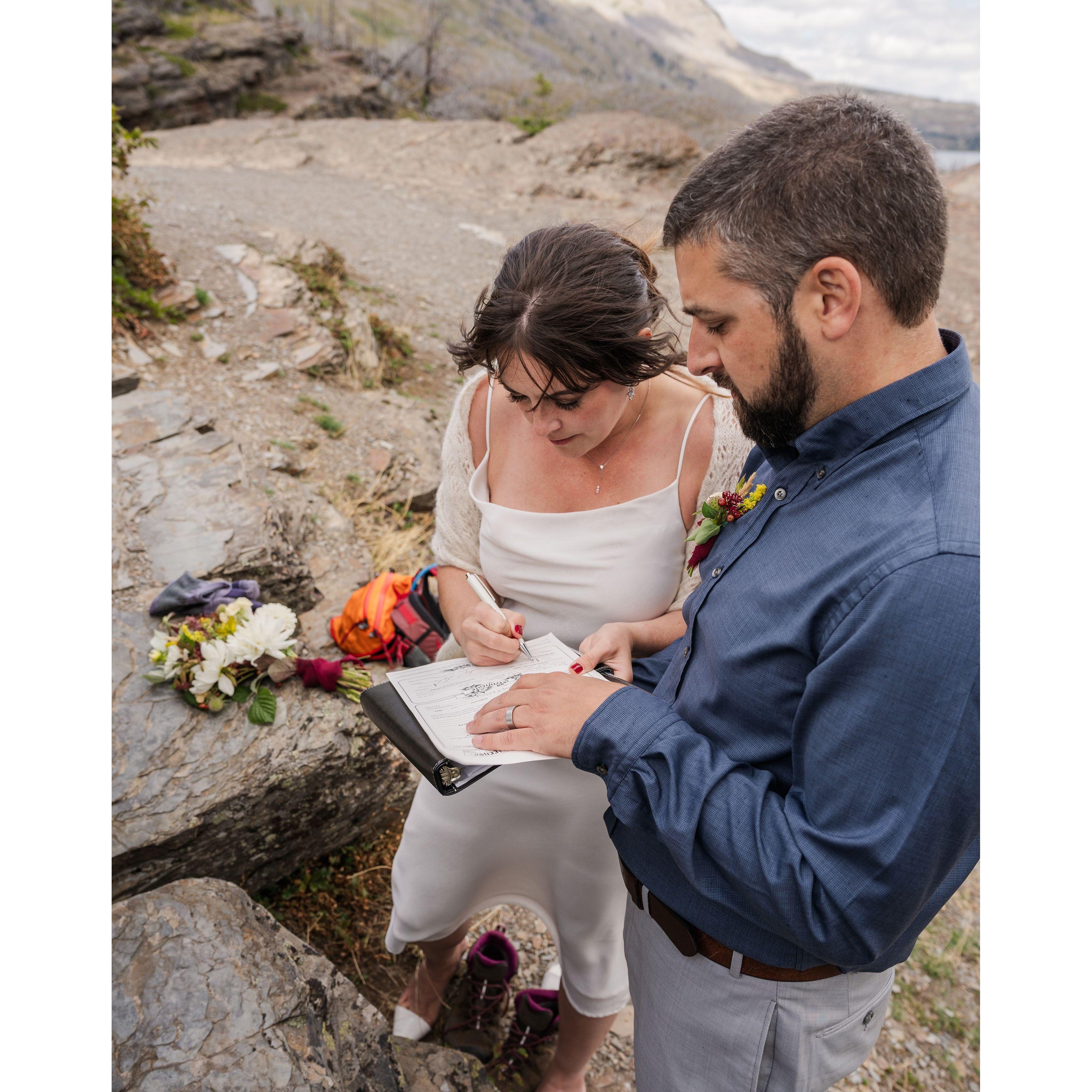 Signing the marriage license (after it almost blew away!)